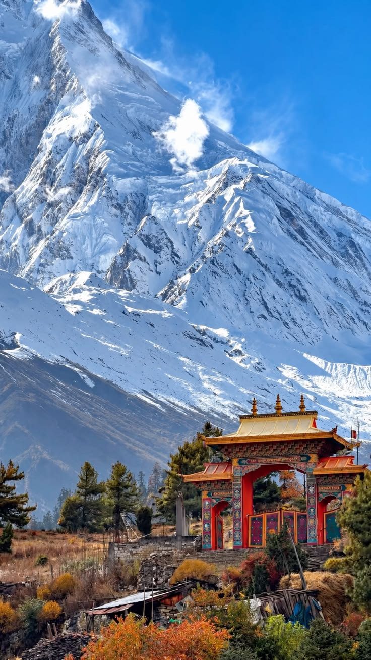 Monastery gate below a Himalayan peak, Nepal