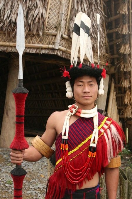 Naga man in traditional attire with a spear