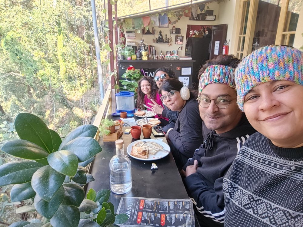 Friends having breakfast at a café in the hills
