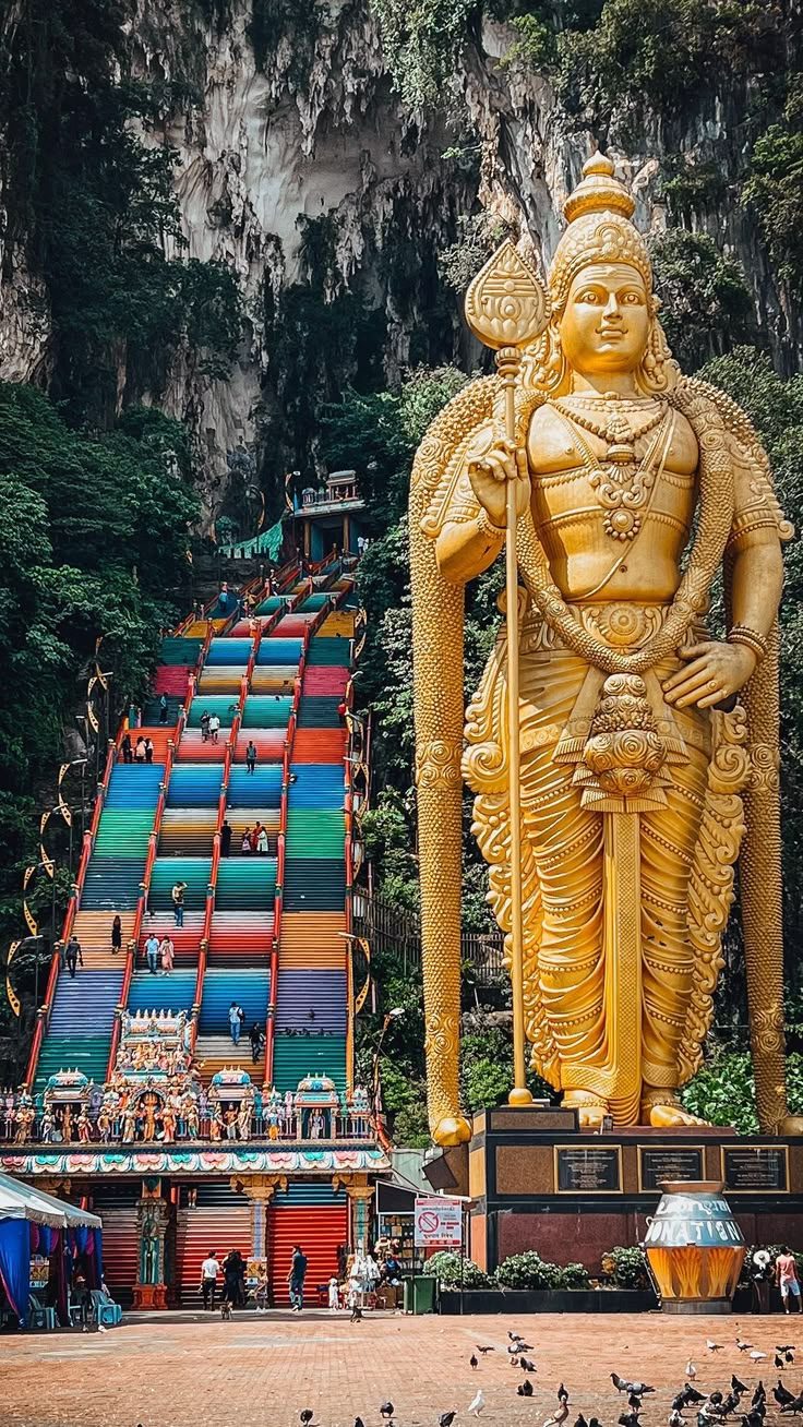 Rainbow steps and golden statue at Batu Caves, Malaysia