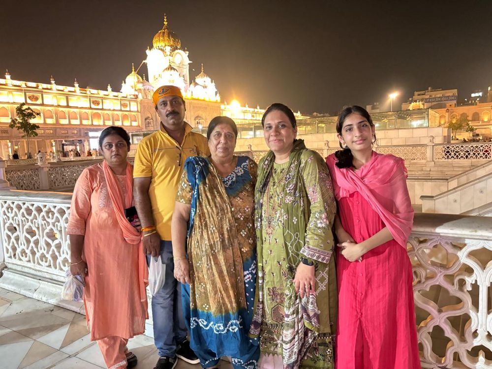 Family at the Golden Temple at night, Amritsar