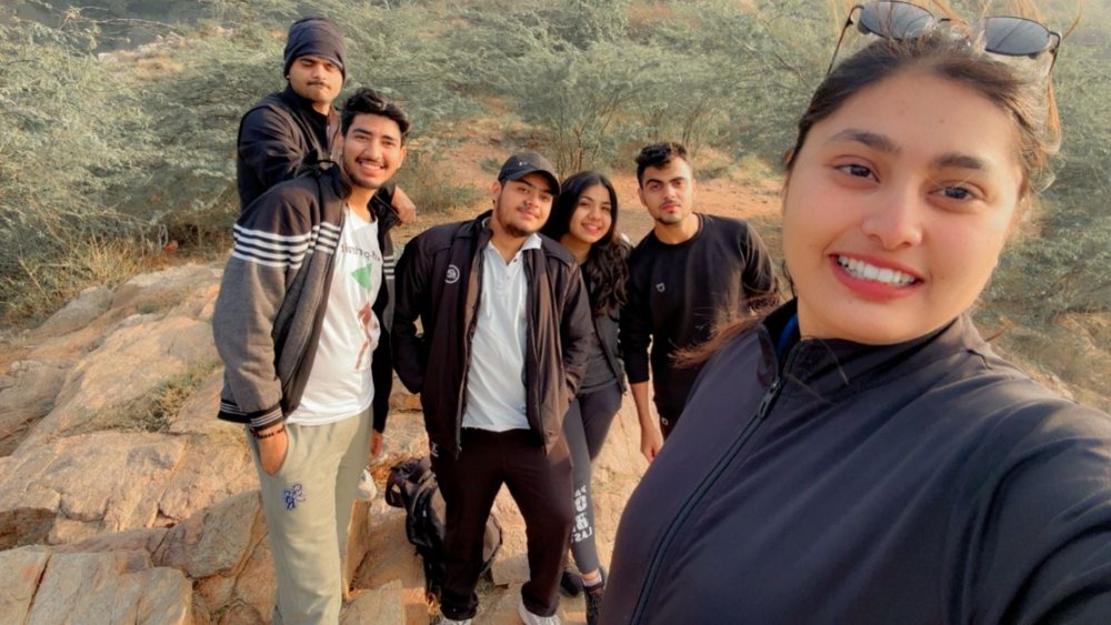 Group of friends taking a selfie on a sunrise hike