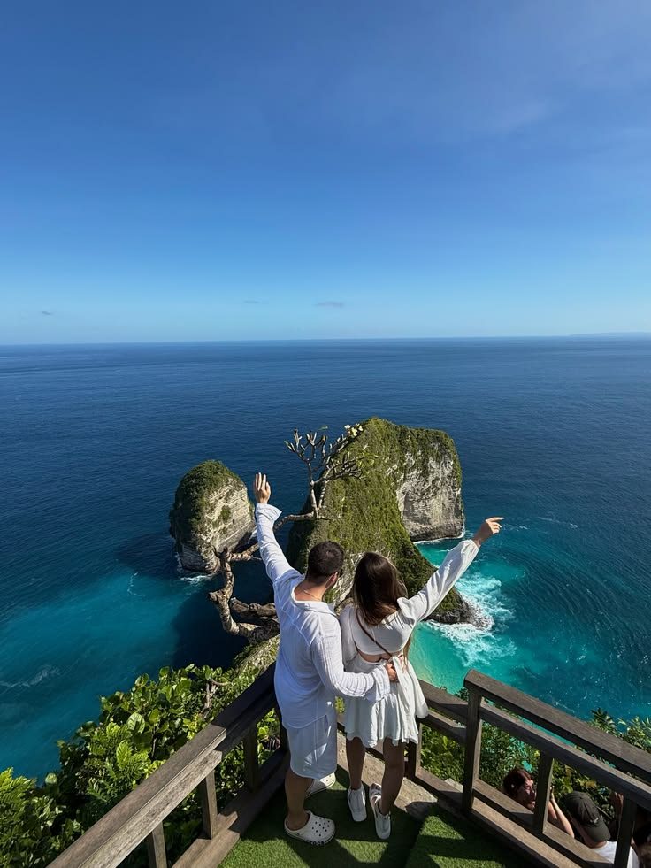 Couple at a clifftop viewpoint over the sea, Bali