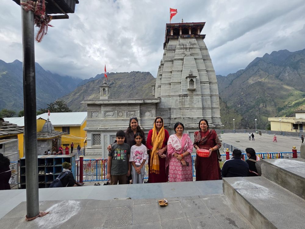 Family group in front of a mountain temple
