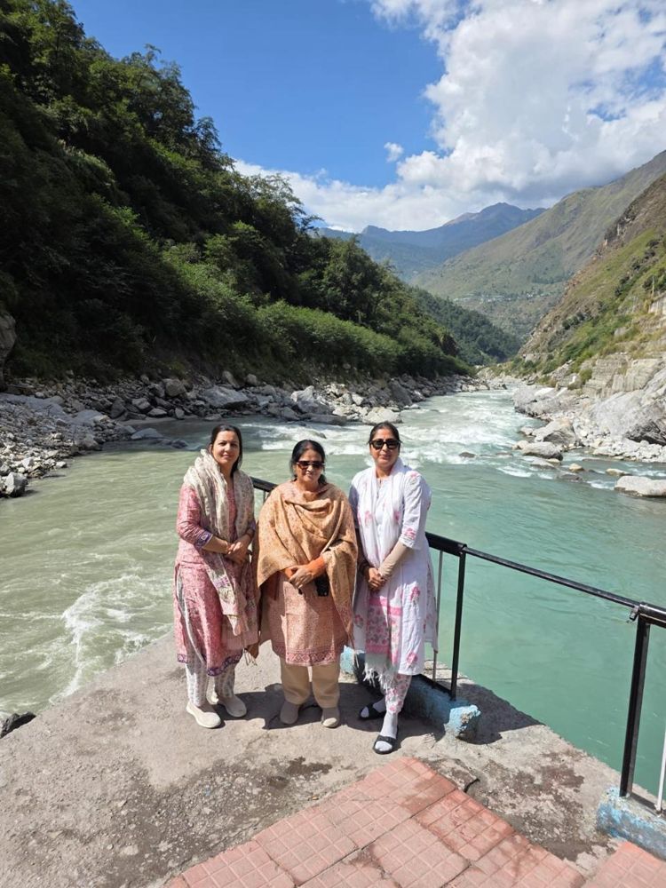 Travellers beside the Alaknanda river