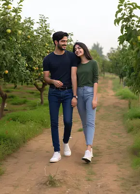 happy-couple-walking-in-apple-orchard-in-kashmir